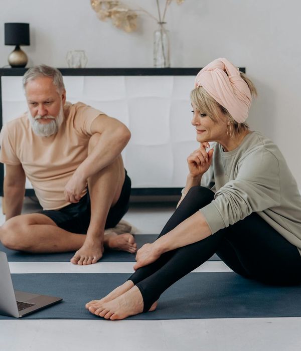 Man smiling and looking relaxed after a workout session.